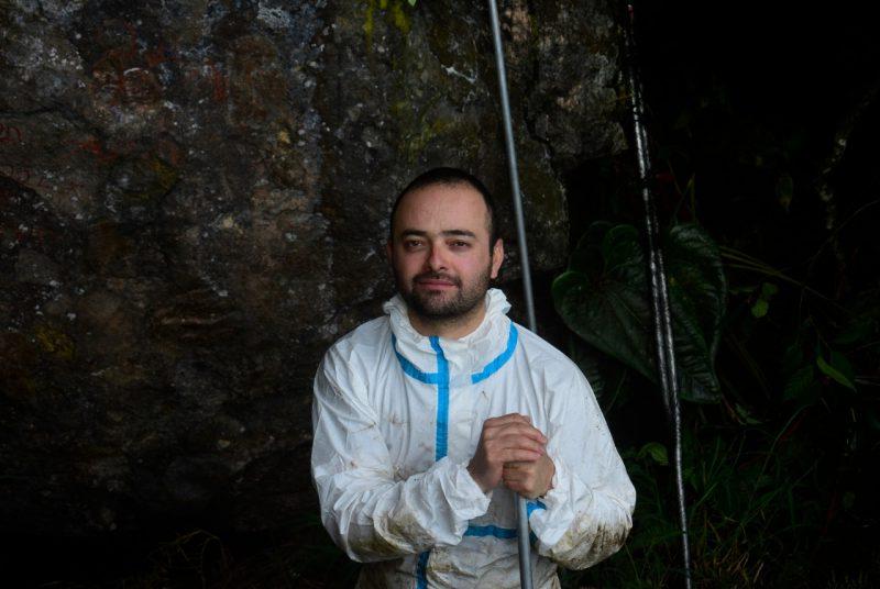 Luis Escobar wearing a biohazard suit.